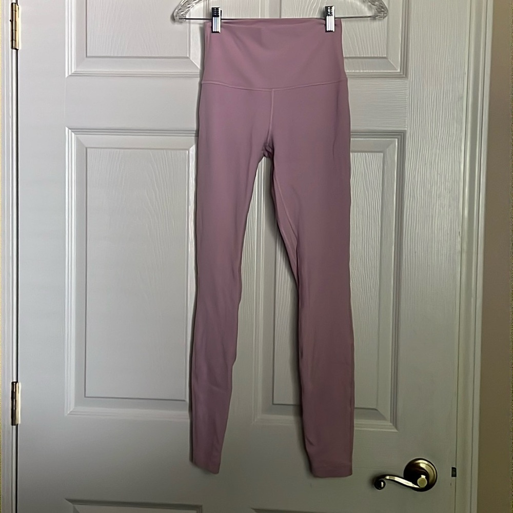 Pale pink full length lululemon pants.  Size 4